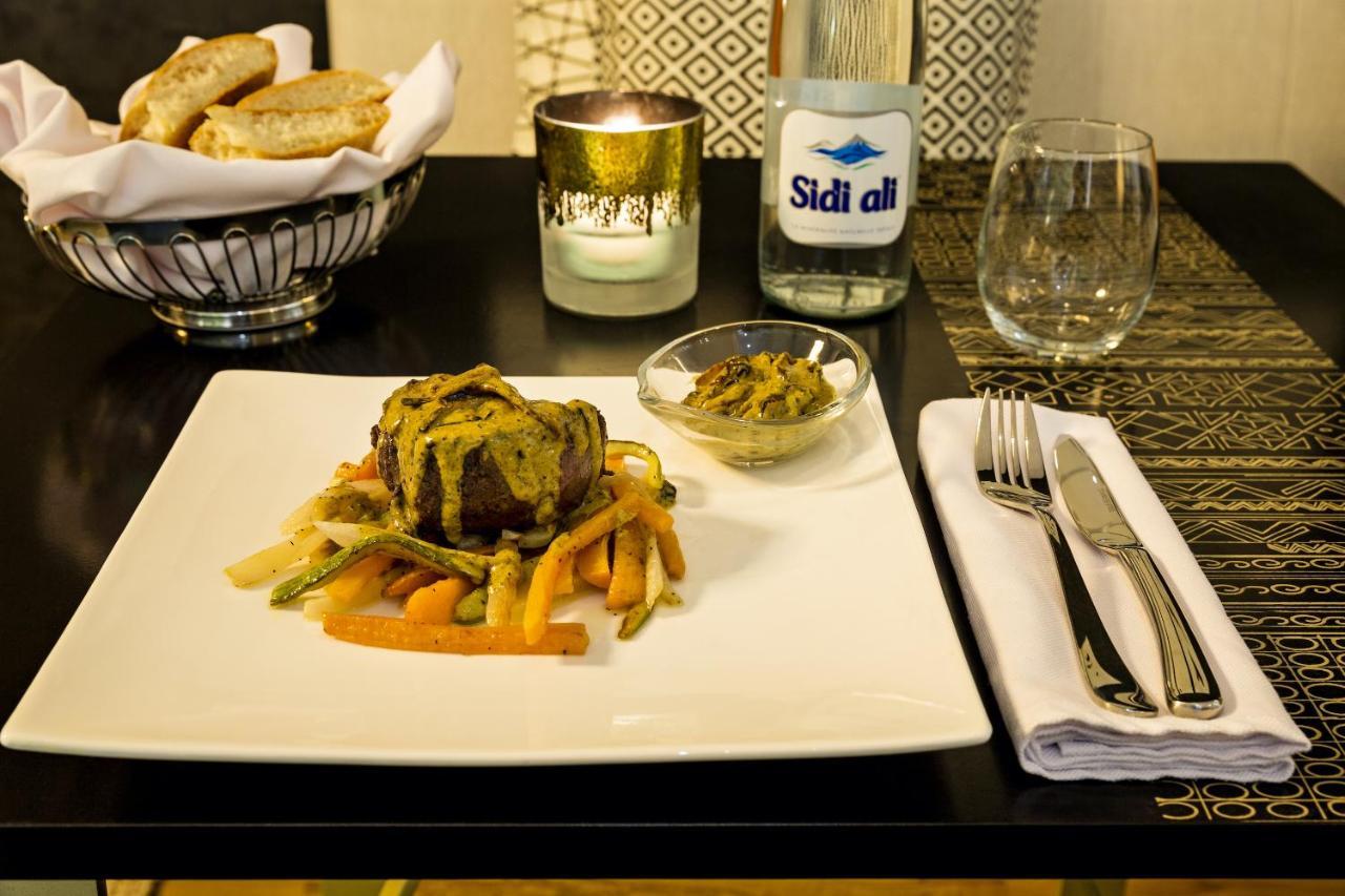 Suite Azur Hotel Essaouira Exterior photo A Moroccan meal